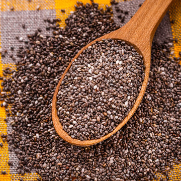 chia seeds on a light rustic background © Narsil