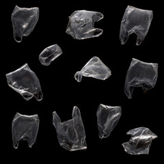 Flying plastic bags on a black background. Can be used for combination in images. Contamination of the planet concept.