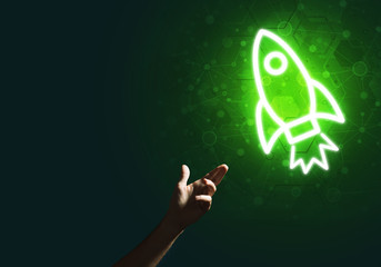 Man palm presenting Rocket web icon as technology concept