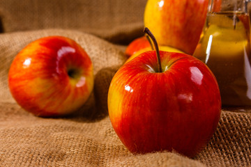 apple vinegar on a wooden rustic background