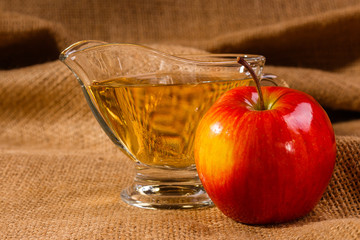 apple vinegar on a wooden rustic background