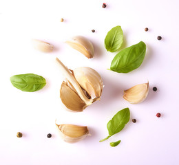 Composition with fresh garlic, basil leaves and peppercorn