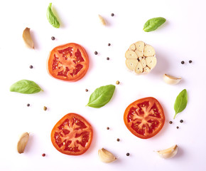 Composition with fresh garlic, basil leaves, tomato and peppercorn