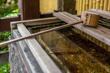 Stillness at the water basin at the entrance of a shrine in Japan for the riual Temizuya purification - 4