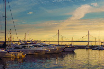 yachts at sunset. beautiful bridge. berth