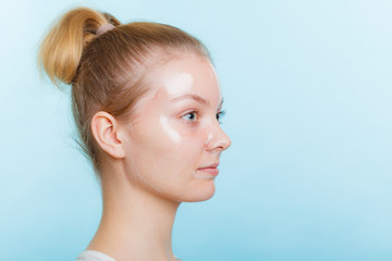 woman in facial peel off mask.