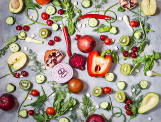 Flat lay fresh vegetables, fruits and herbs on concrete background.