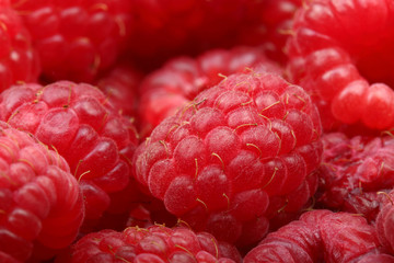 Juicy and fresh ripe raspberries close-up. Natural background