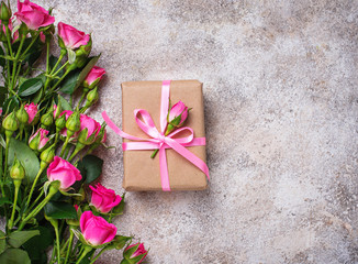 Pink roses and gift boxes with ribbons