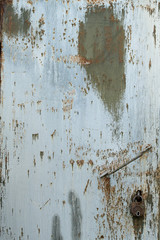 The Texture Of A Rusty Iron Door With A Lock And A Handle.