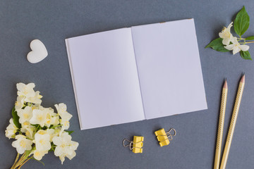 Mockup notebook with white jasmine flowers