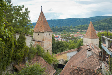 Fototapeta na wymiar Medieval fortification towers in Romanian city Sighisoara 