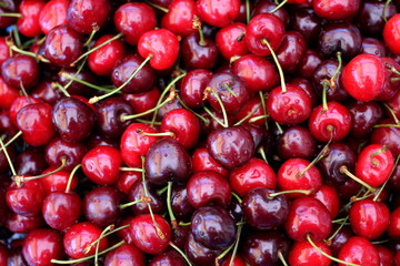 Heap of cherries, close-up, copy space