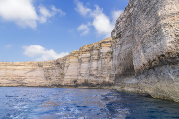 Dwejra, the island of Gozo, Malta. Sheer rocks on the beach