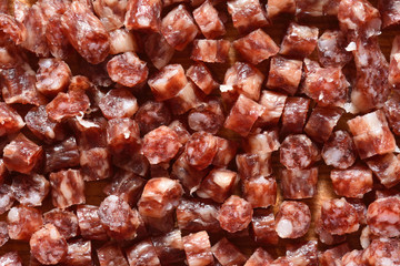 Very finely chopped small sausage. Sliced sausage for pizza