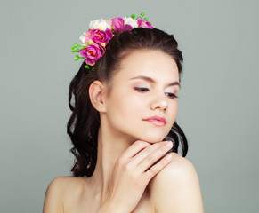 Happy Prom Girl with Perfect Hairstyle and Makeup Isolated on White Background. Young Woman with Flowers in Hair