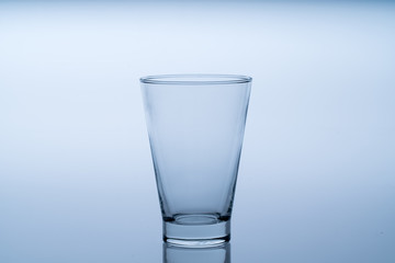 Close up pouring drinking water into glass, studio shot