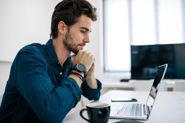 Application developer working on computer in office