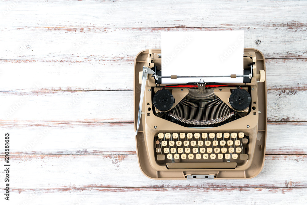 Fototapete top view of retro style typewriter in studio