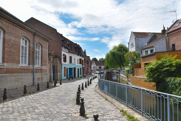Street Motte, paving, channel and old buildings in the  Amiens, France, Europe. 