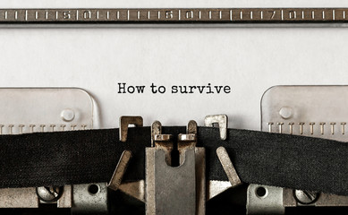 Text How to survive typed on retro typewriter