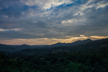 A Cloudy at sunrise timing above on mountain at morning time