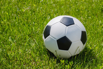 Fototapeta na wymiar Traditional soccer ball on soccer field