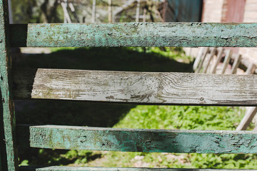 Old rustic village fence background. Wooden painted planks texture with scratches.