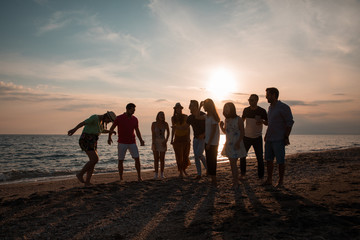 people silhouette at sunset