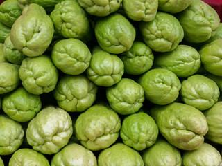 Green color of guava arranged on table