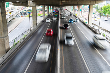 Motion blur of car on the road in the city