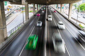 Motion blur of car on the road in the city