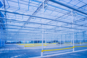 The frame of a modern empty greenhouse