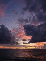 Colorful tropical cloudscape sunset sky above the ocean