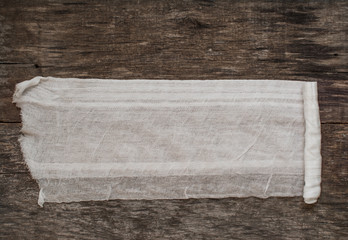 Fototapeta na wymiar medical bandage on a wooden table
