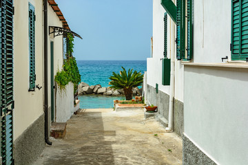 small street in town Pizzo leading to the beach on tyrrhenian sea, Calabria, Italy