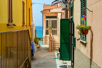 small street in town Pizzo leading to the sea, Calabria, Italy - obrazy, fototapety, plakaty