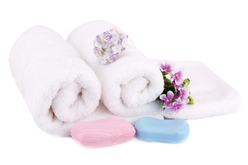 Fototapeta na wymiar Towel, soaps and flowers