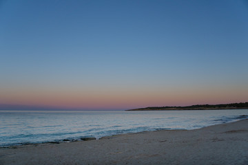 Fototapeta na wymiar Mallorca, Afterglow sky at sand beach on holiday island near cala millor