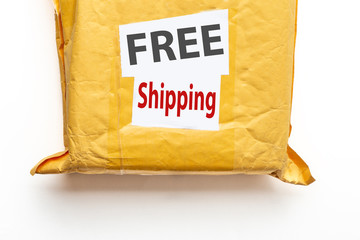 FREE Shipping text on yellow parcel package or cargo box with product, free logistic shipping and distribution at online internet shopping