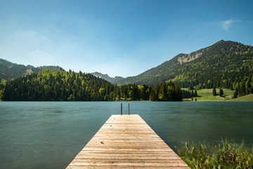 A long time exposure at the Spitzingsee with a view to the mountains