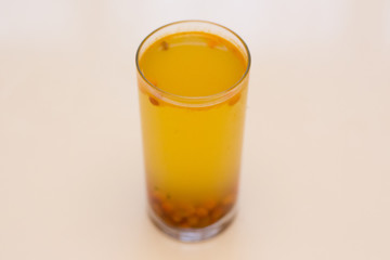 Compote of sea-buckthorn  in a glass