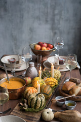 Autumn table setting with pumpkins. Thanksgiving dinner and fall decoration.