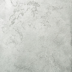 Obraz premium Textured background. Decorative plaster walls, external decoration of facade. Texture of silver.