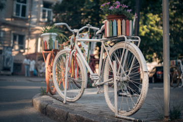 Fototapeta na wymiar white vintage bicycle in european town;