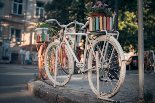 white vintage bicycle in european town;