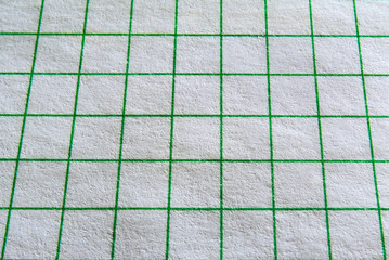 A sheet of paper in a close-up cage.