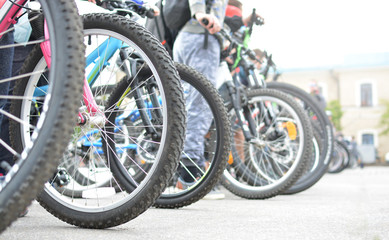 Bicycle wheels. A group of cyclists. Bicycle tour