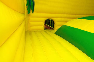 large inflatable yellow trampoline located in the children's entertainment center