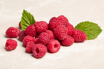 Ripe aromatic raspberries on table, closeup